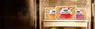 fresh selects packages on refrigerator shelf