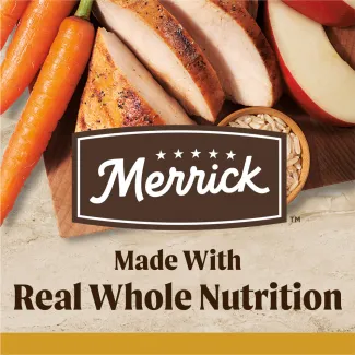 A top down photo of carrots, cooked sliced chicken apple slices, and brown rice sit on a wooden serving board with the Merrick logo overlapping; text below reads "made with real whole nutrition" 