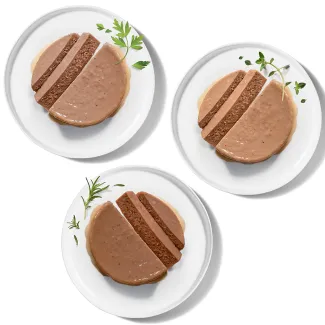 Bowls of three Merrick grain-free wet cat food pate recipes.